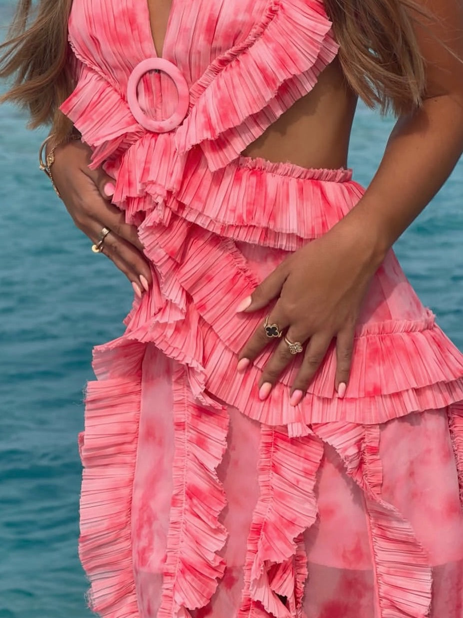 Close-up of a pink pleated dress by Anne Louise Boutique